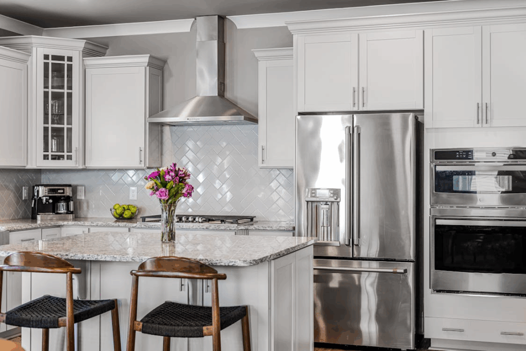 Modern kitchen with granite countertops, a smart home improvement that adds value before downsizing.