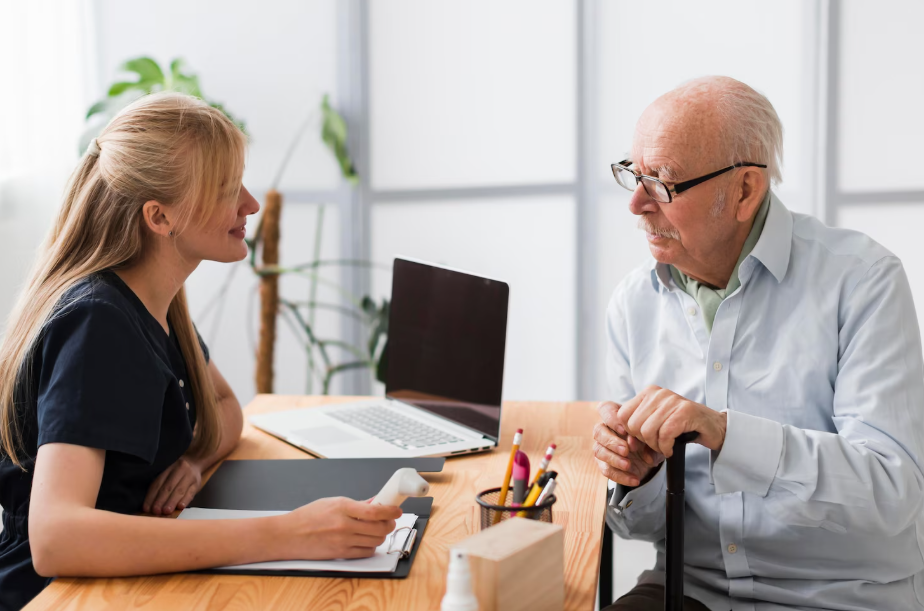 Senior man consulting with a financial advisor about Social Security claiming strategies.