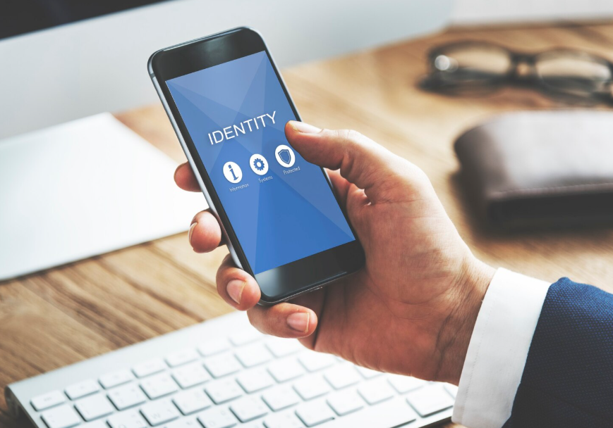 Person using smartphone identity protection app to age-proof finances against scams